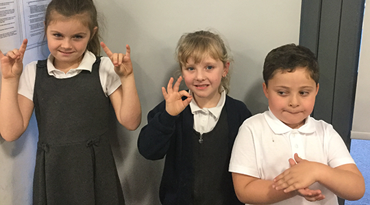 Three pupils -two girls and a boy