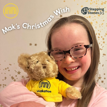 Young girl with Down's syndrome cuddling Mak the Bear